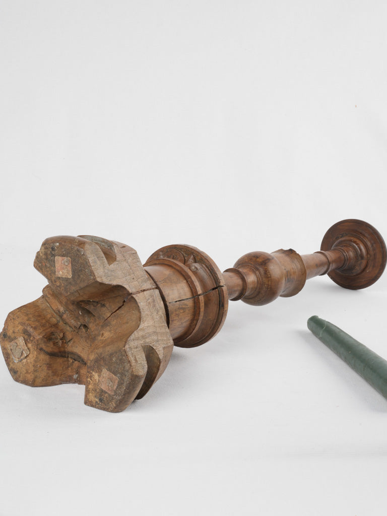 Patinaed Italian walnut candlestick silhouette