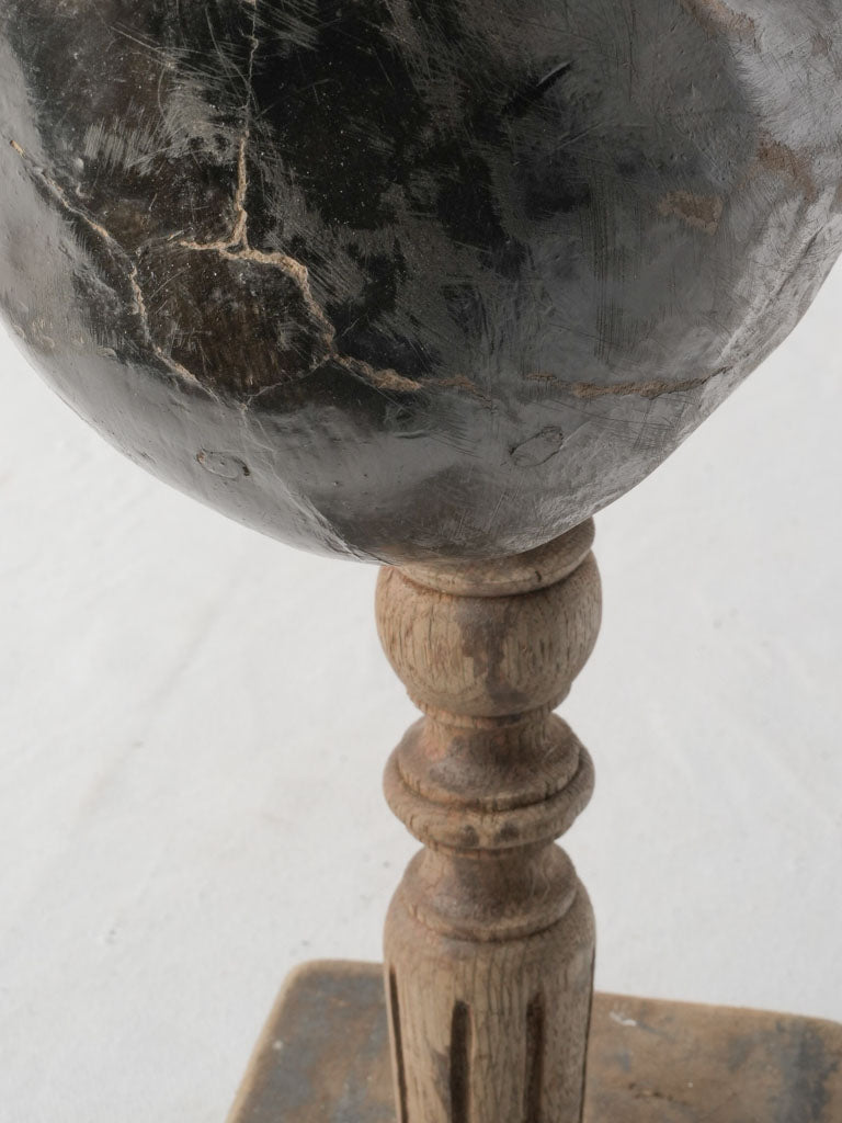 Coastal-inspired dark wood ornament