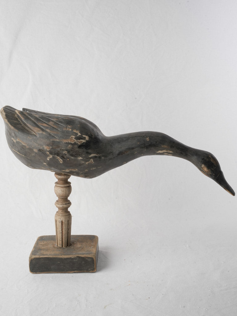 Weathered dark grey wooden decoy