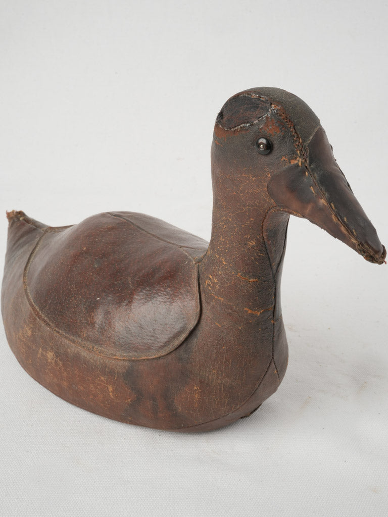 Antique rustic leather duck decoy