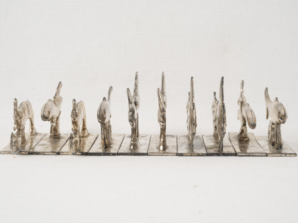 Weathered, seafood-shaped knife rests