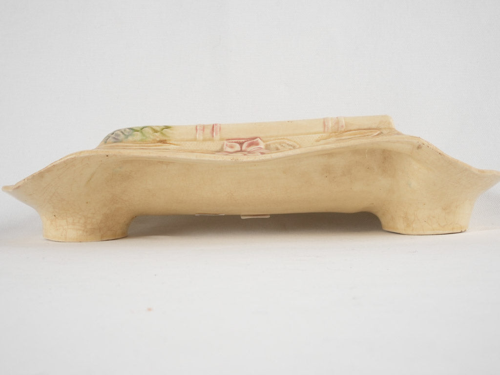 Floral-decorated faience vegetable cradle