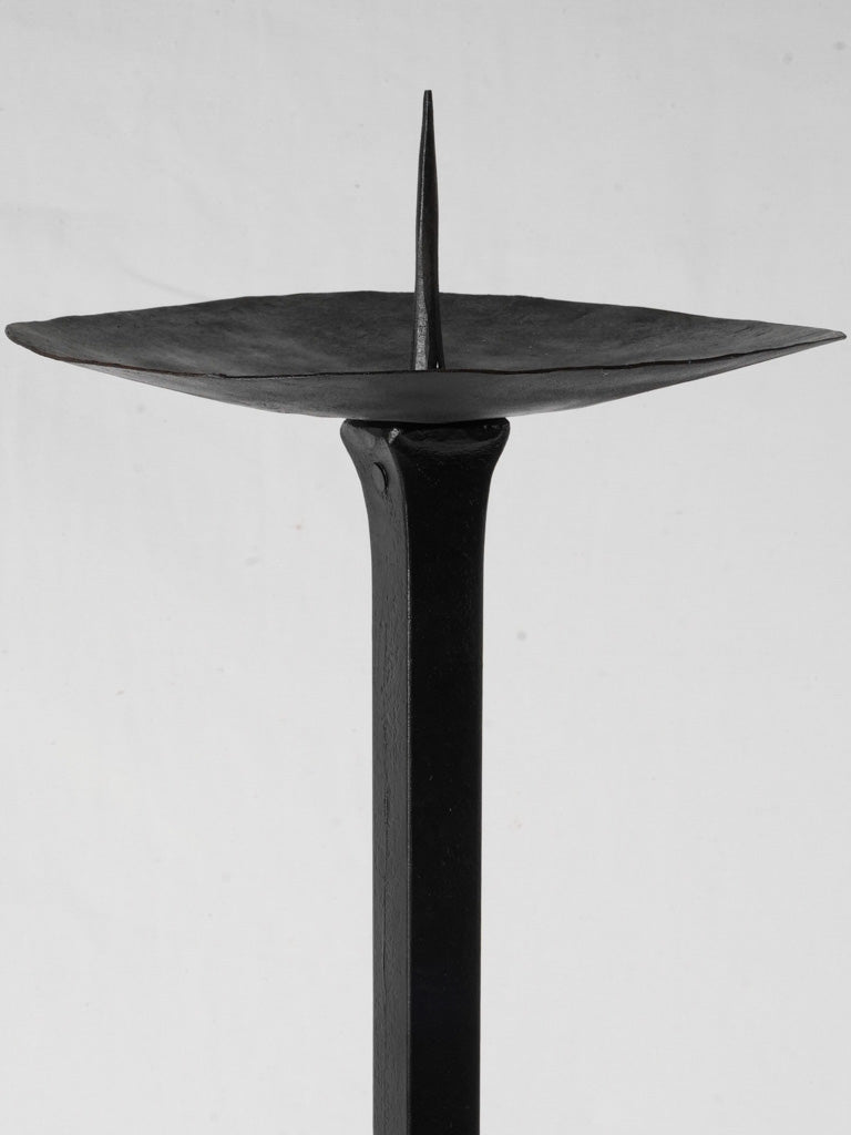Slender tripod-base candlestick