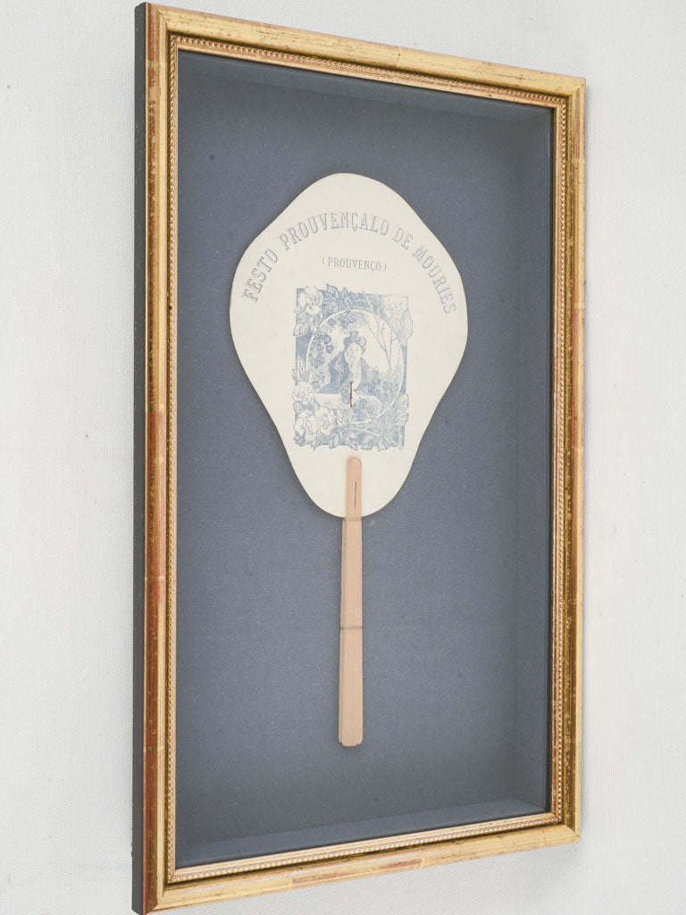 Vintage paper fan in gilded shadow box