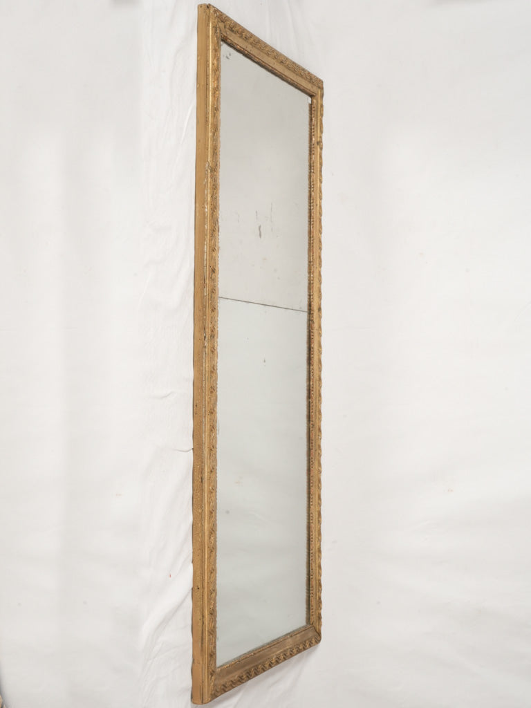 Ornate aged giltwood decorative mirror