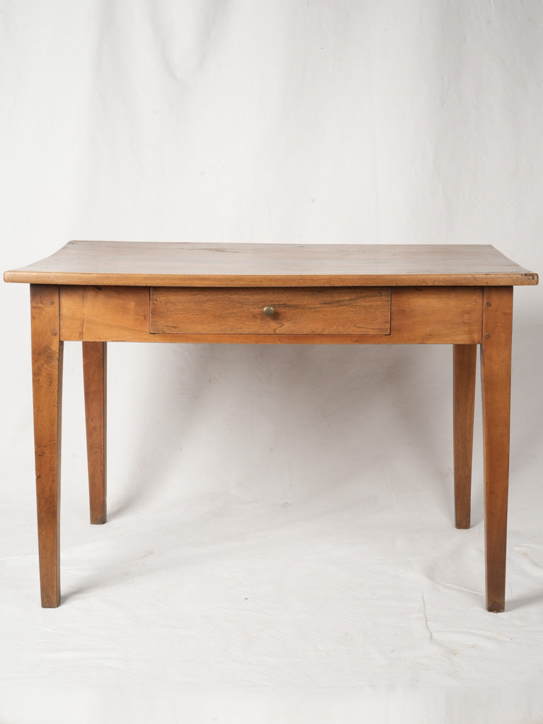Tapered leg walnut dining table