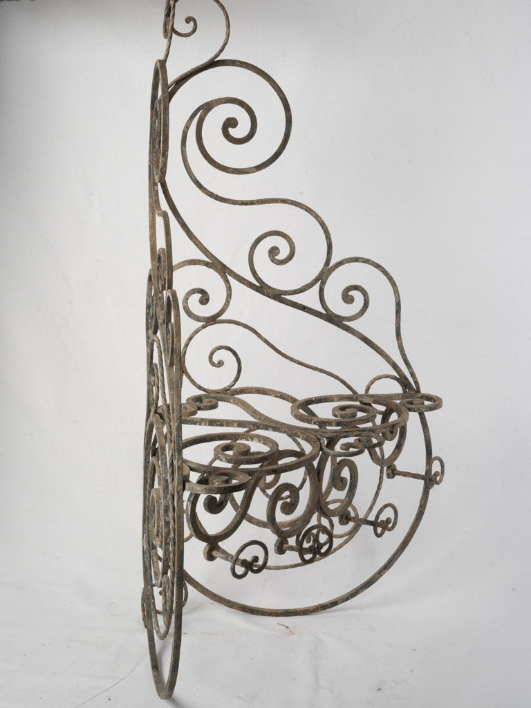Decorative iron scrollwork corner shelves