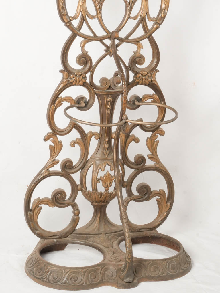 Intricate scrollwork cast iron coat rack
