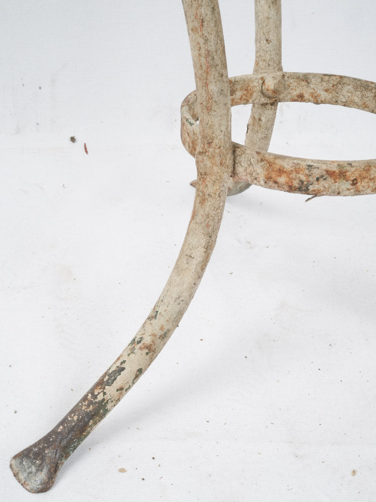Curved wrought iron stool legs