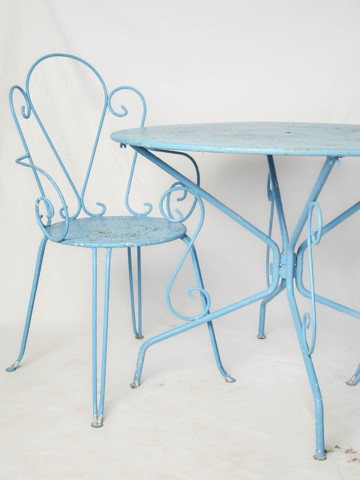 Elegant scrolled wrought iron chairs