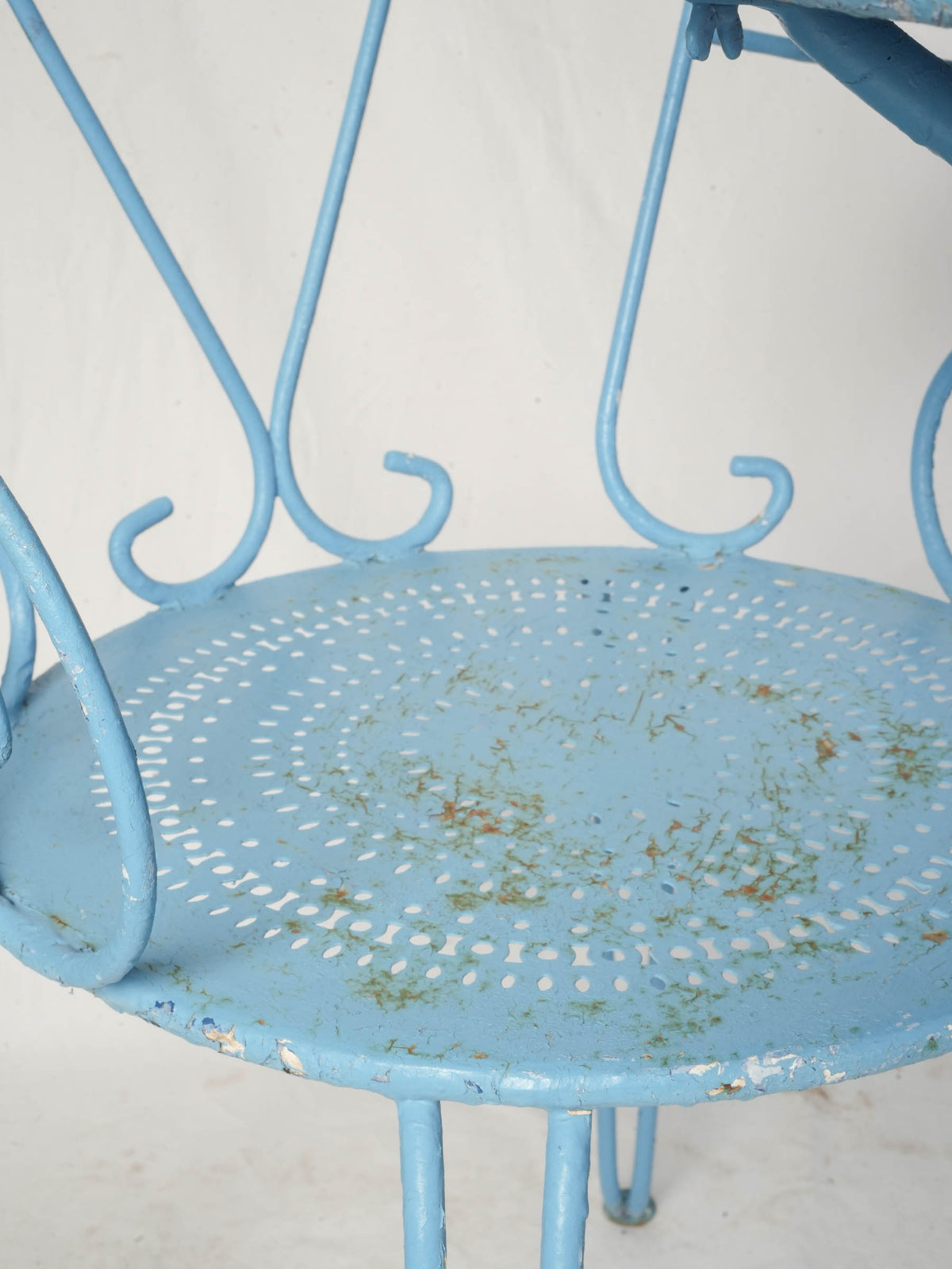 Perforated top table and chairs