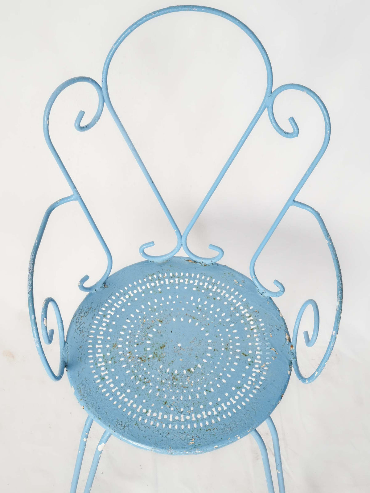 Patinaed wrought iron patio pieces