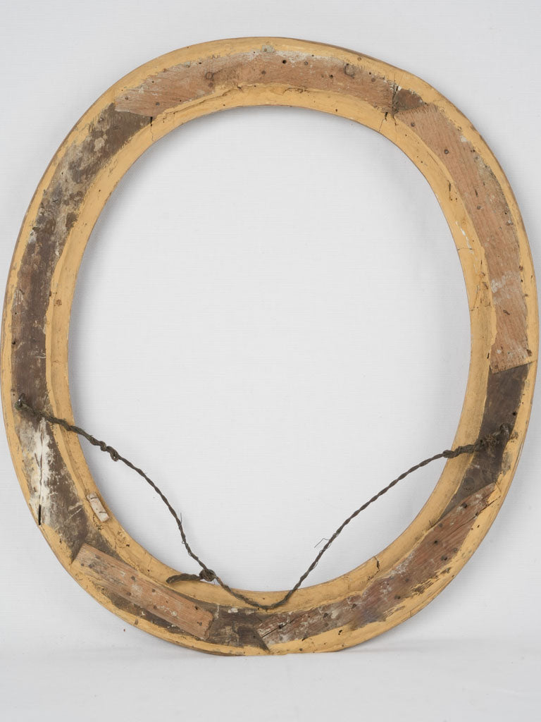 Baroque-inspired oval gilt frame