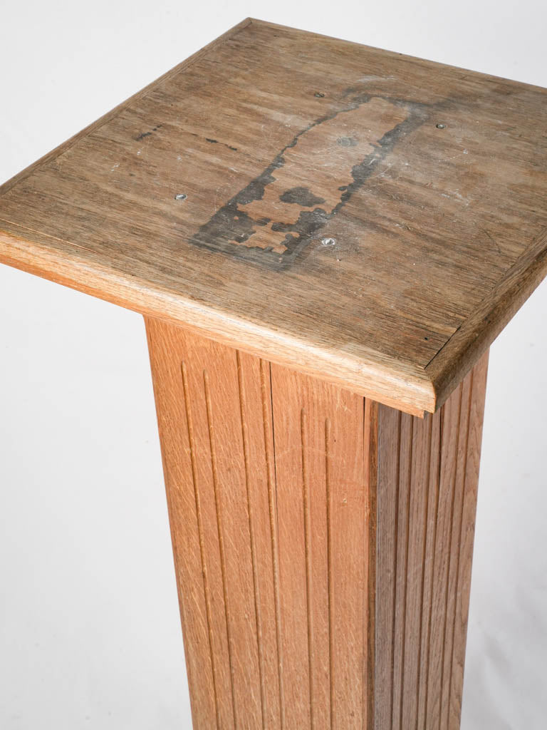 Light-toned solid oak pedestal