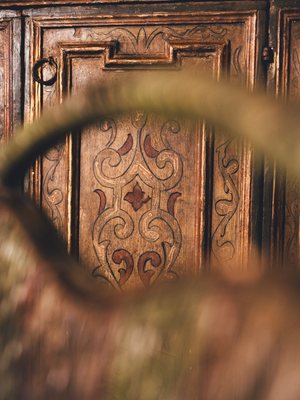 Timeworn polychrome decoration armoire