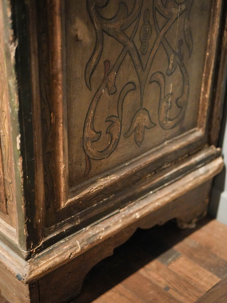 Richly gilded foliate frieze armoire