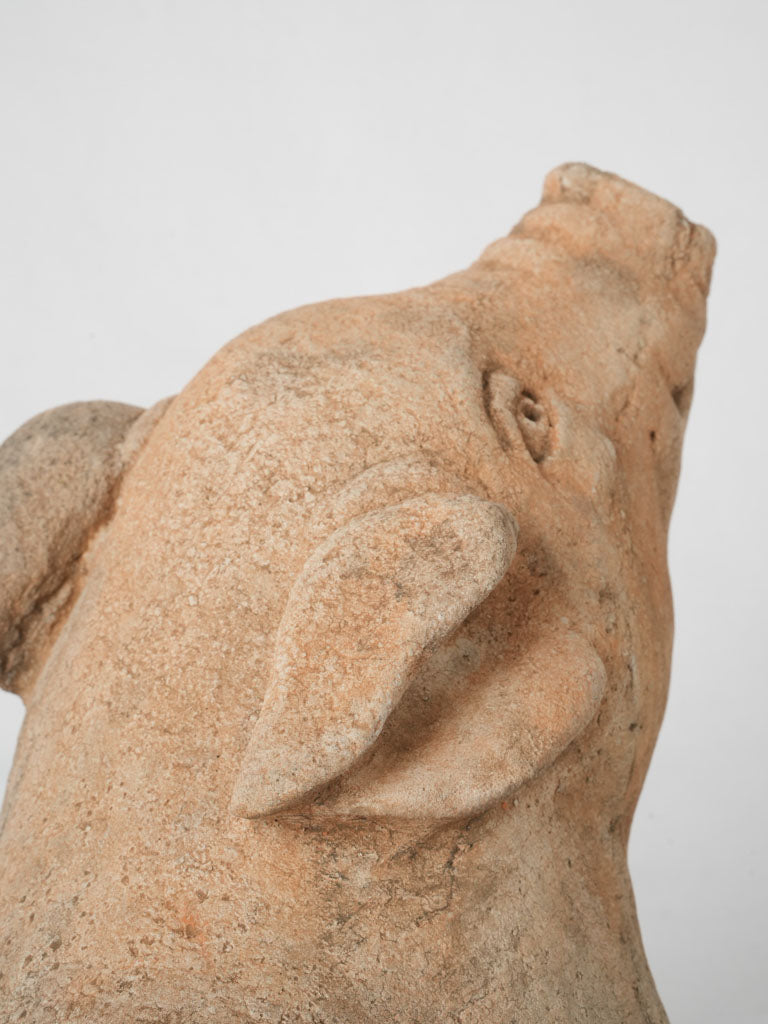 Intriguing reconstituted stone pig sculpture
