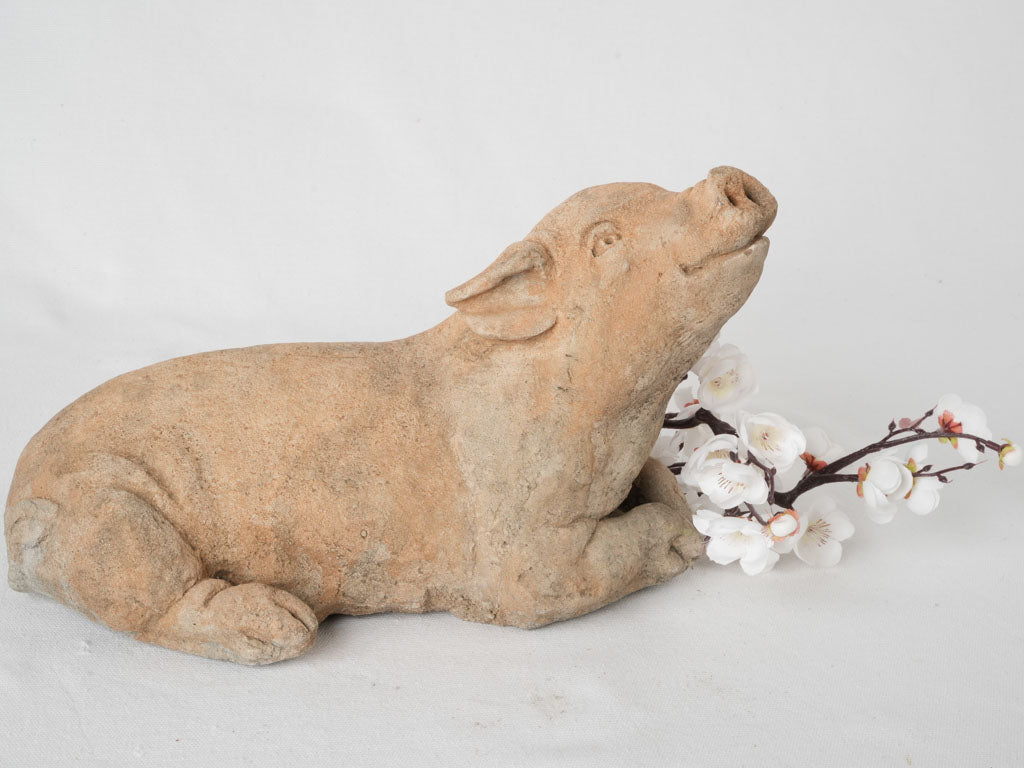 Quaint aged garden pig ornament