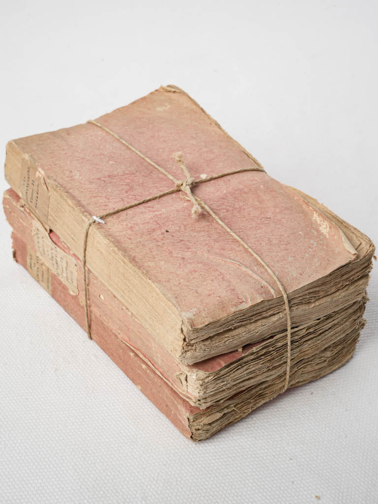 Aged pink French paperback trio
