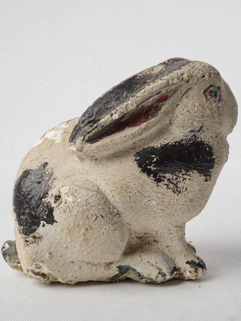 Wear-worn baby rabbit sculpture