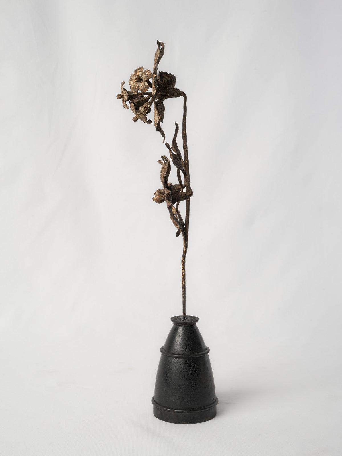 Ebonized base stylized floral sculpture