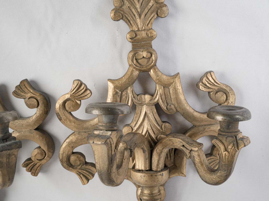 Warm patina gilded wood sconces  