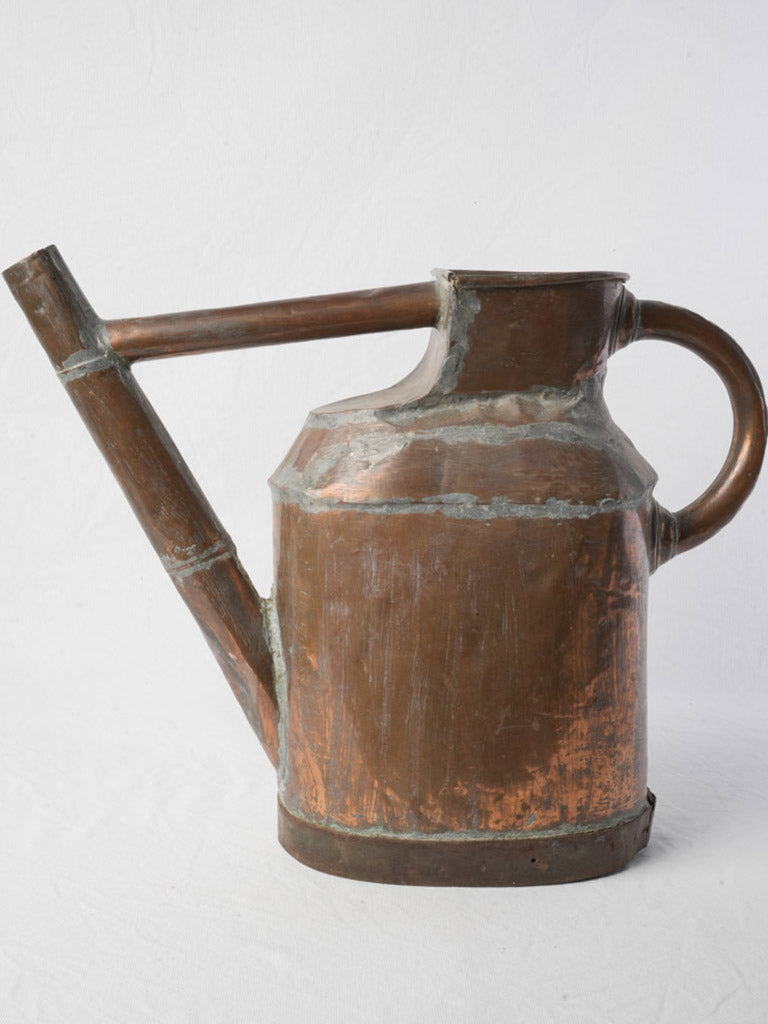Weathered cylindrical watering pot