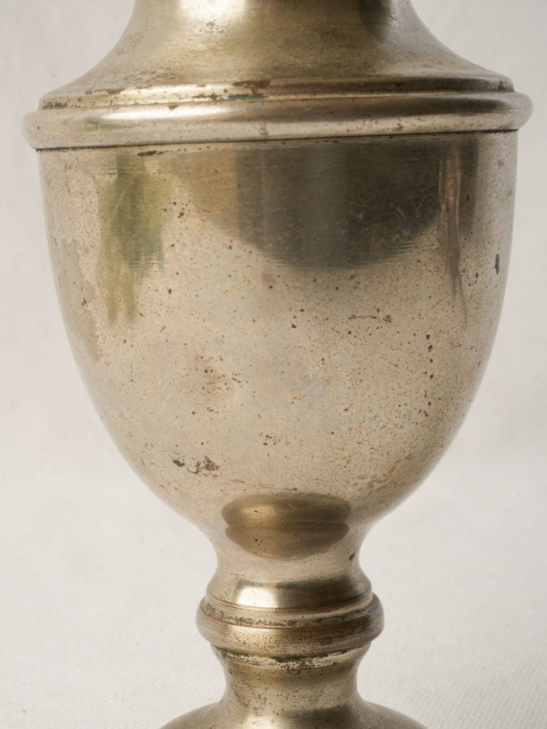 Corrosion-resistant silvery charm
