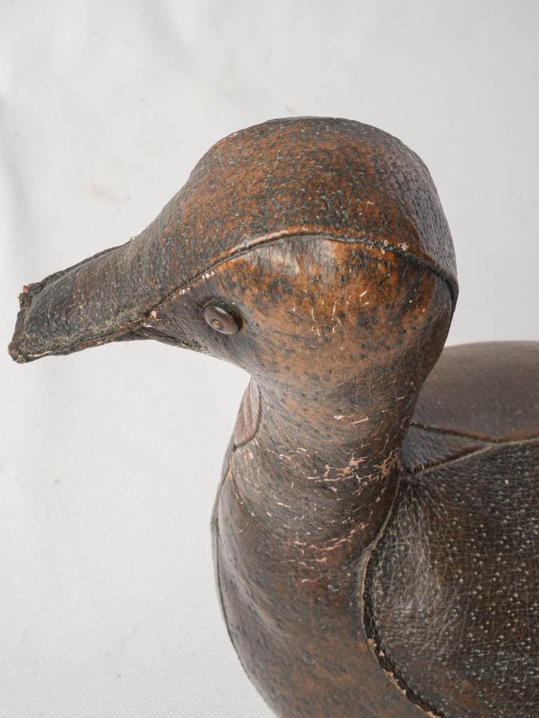 Charming aged leather figurine