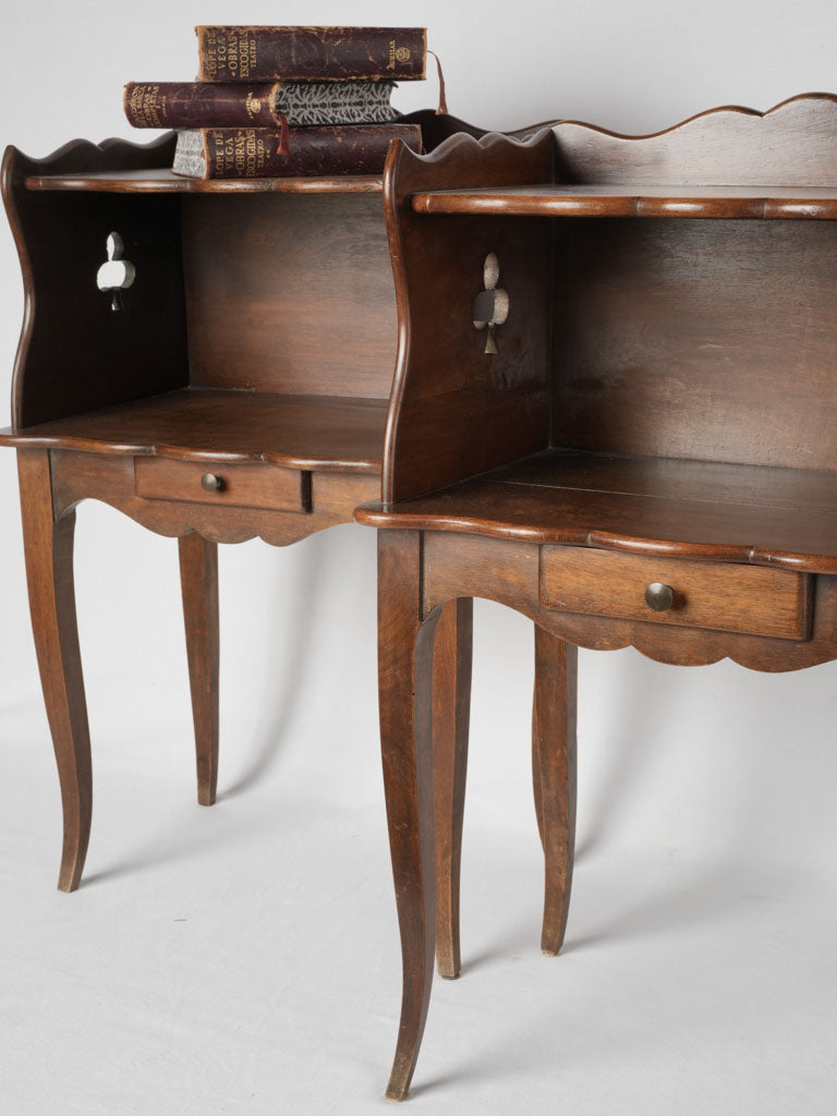 Elegant French walnut nightstands with clover detailing