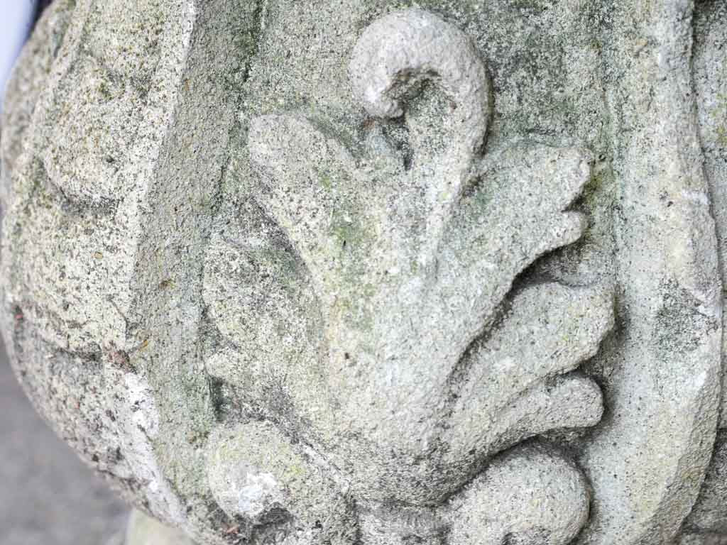 Moss-enhanced stone garden sculpture