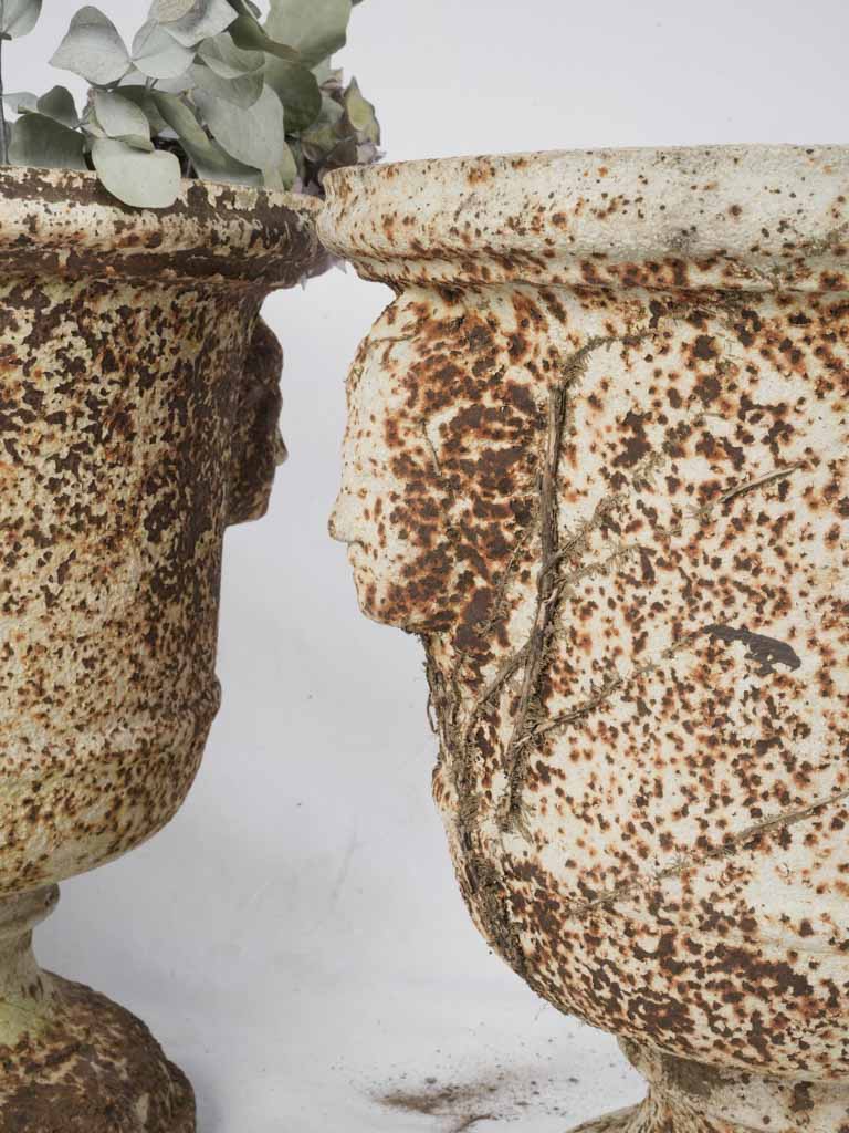 Antique weathered Normandy cast-iron urns