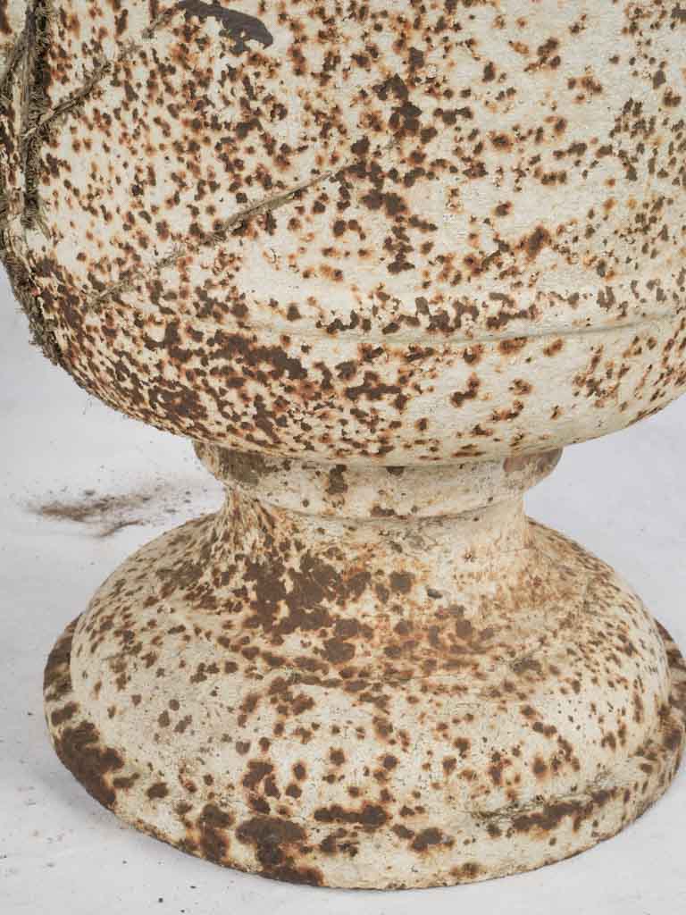 Intricate female head handle urns