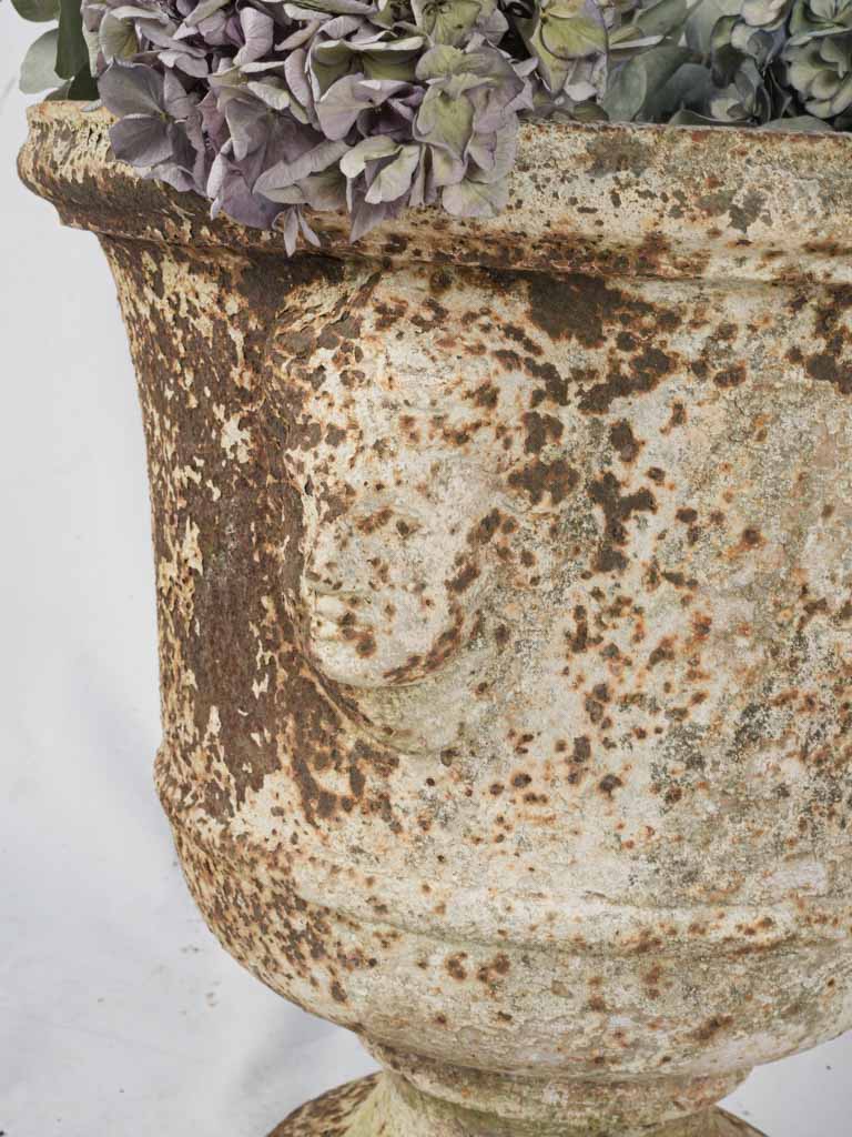 Stately historic cast-iron urns