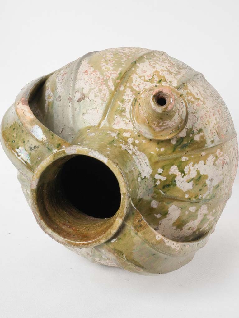 Repaired antique walnut oil pottery