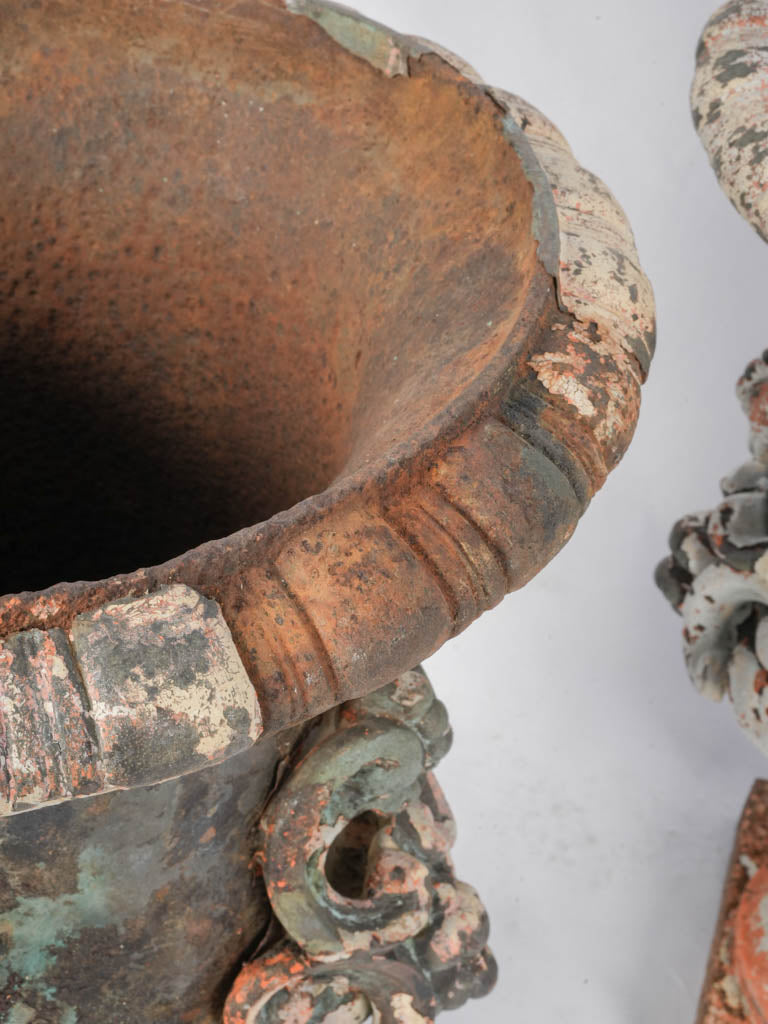 Symmetrical antique architectural urns