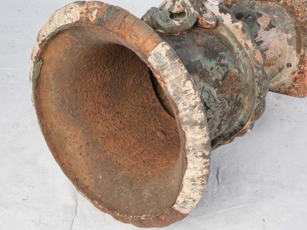 Intricately detailed cast iron urns