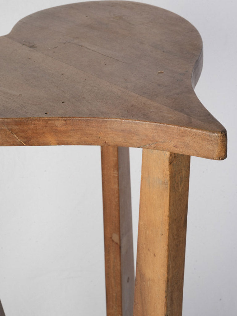 Faceted slender legged pedestal