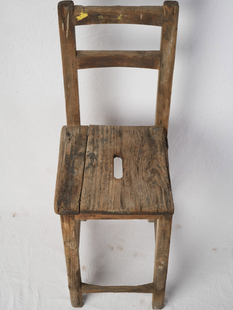 Worn stained solid wood chair