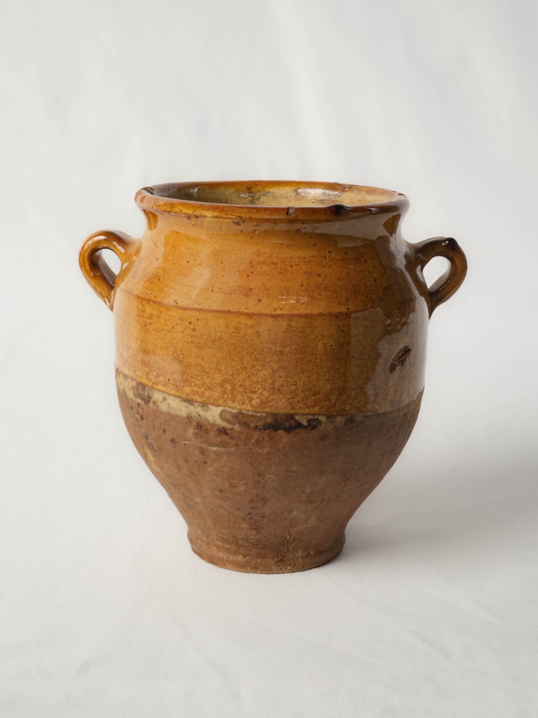 Handcrafted ochre-glazed earthenware vessel
