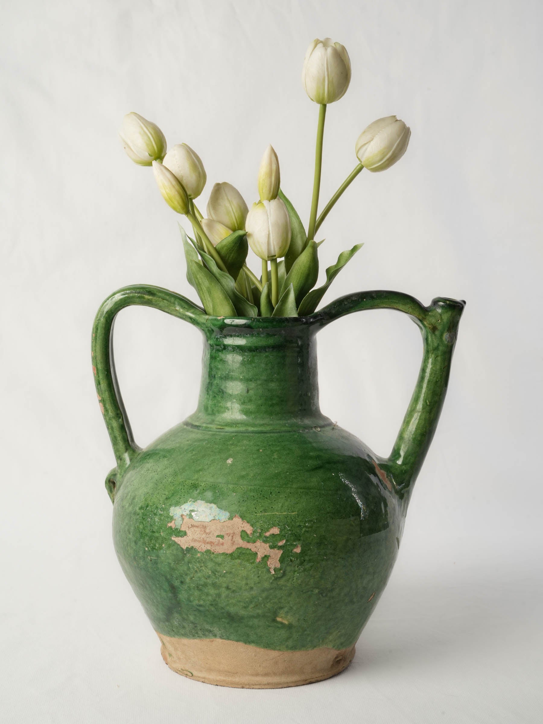 Timeworn apple-green pottery water jug