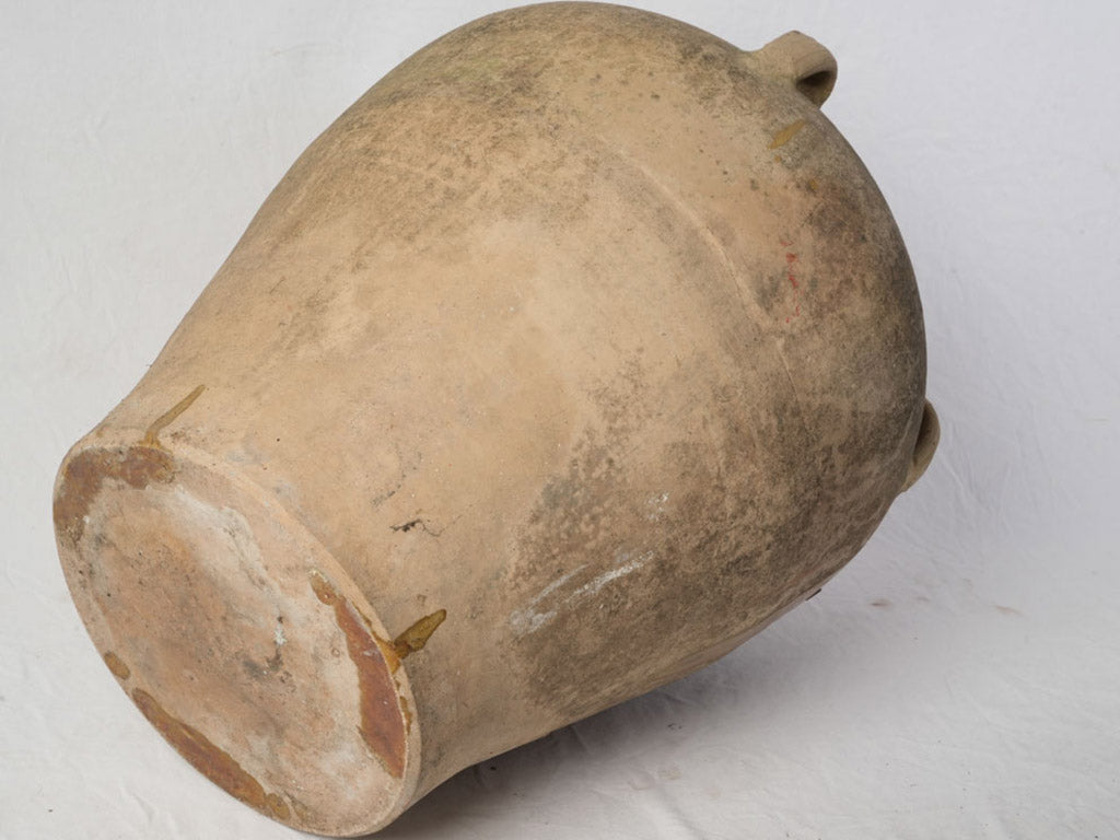 Sun-washed terracotta decorative pot