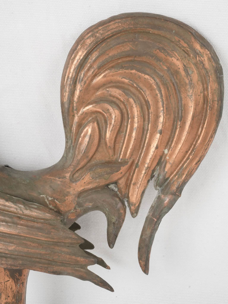 Detailed rooster sculpture fragment