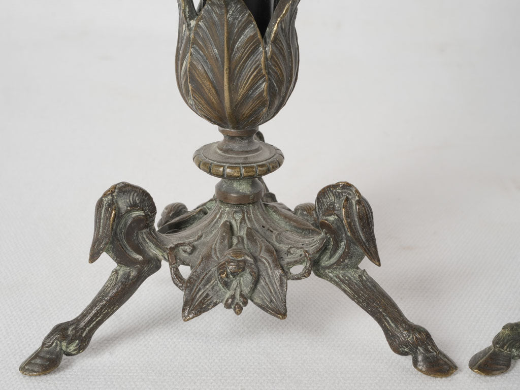 Patinated bronze candlestick duo