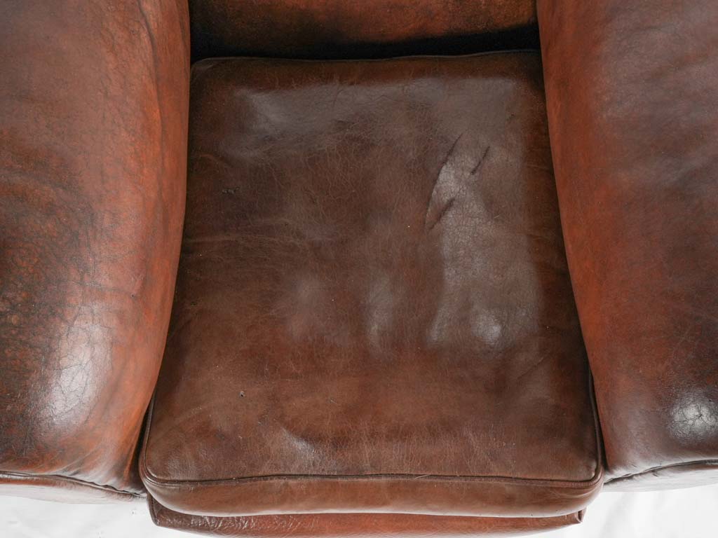 Large 1930s Havana moustache back leather club chair