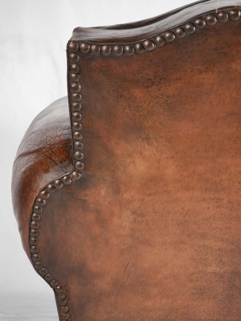 Large 1930s Havana moustache back leather club chair