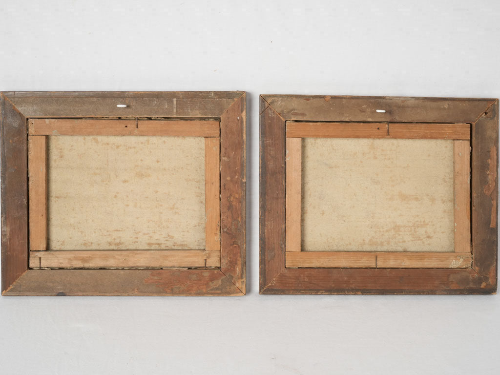 Aged wooden framed oil paintings