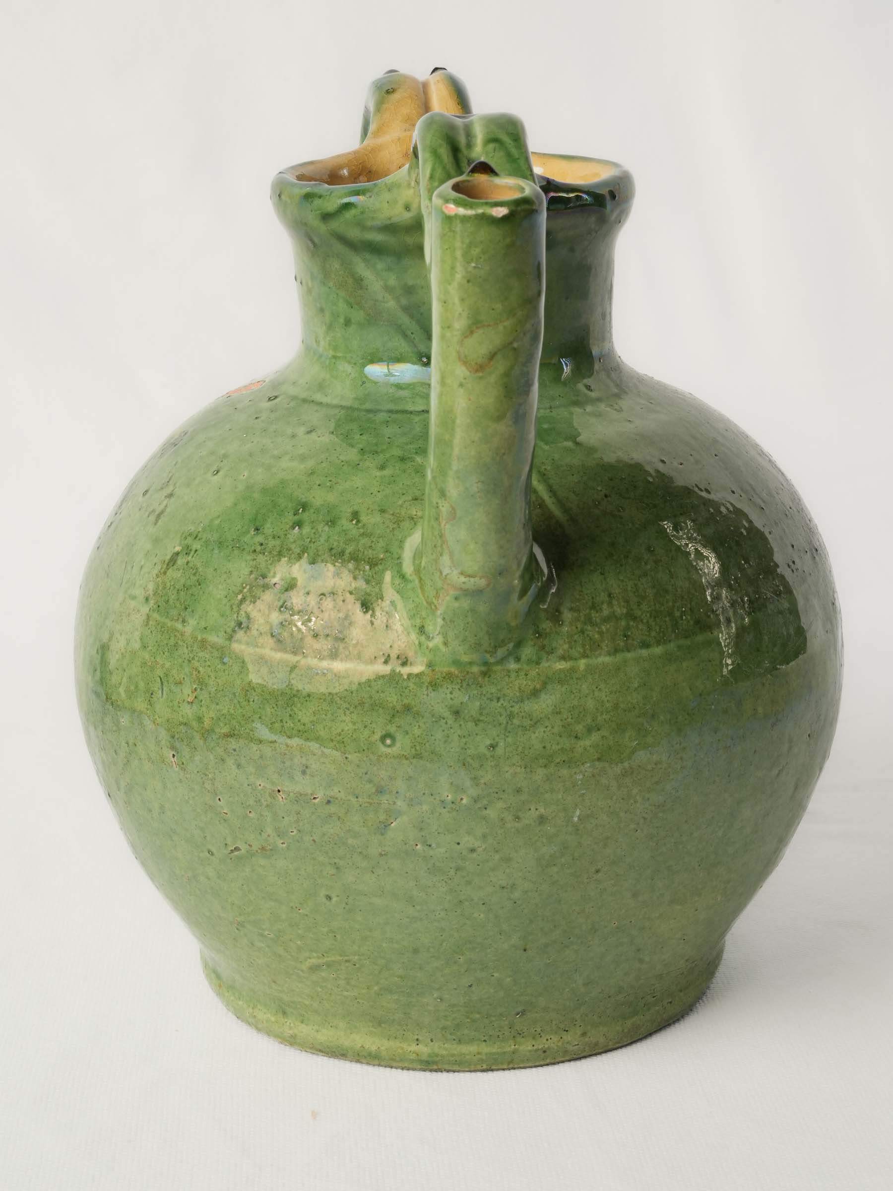 Handcrafted bulbous vessel with handles