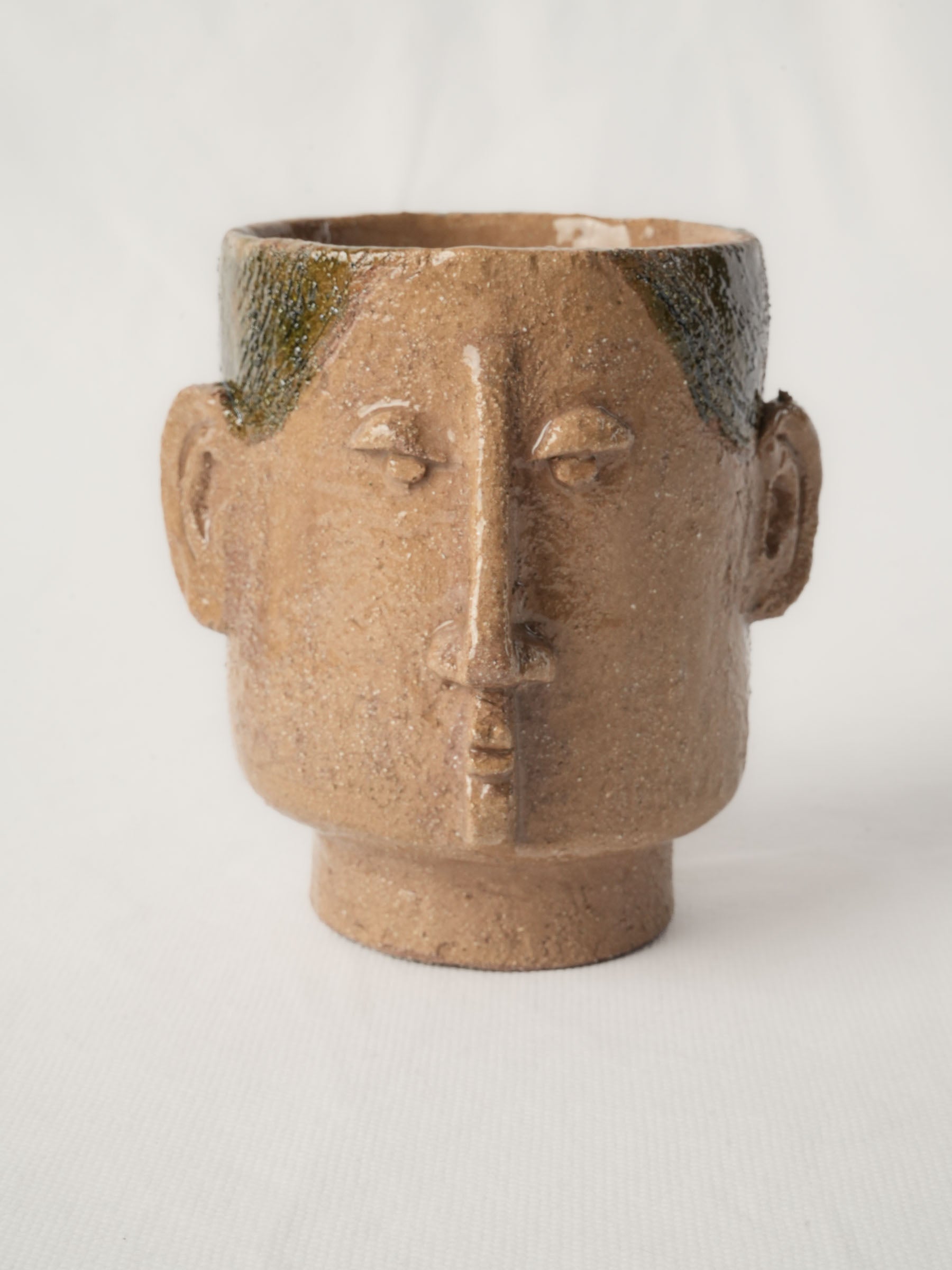 Olive-green glazed ceramic cups
