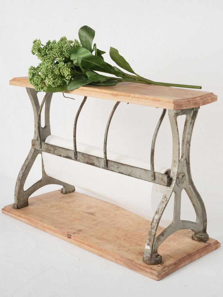 Antique industrial wrapping paper holder